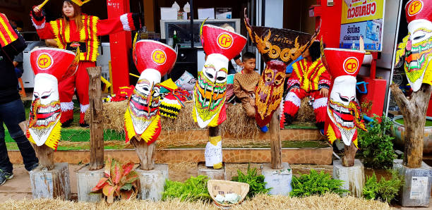 Phi Ta Khon Festival Thailand with colorful ghost masks during the traditional parade in Loei Province